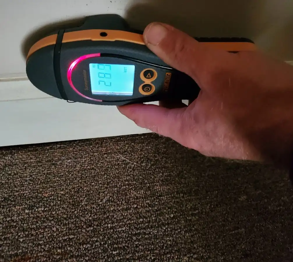 Moisture detection at baseboard during Storm Damage Restoration in Ellettsville